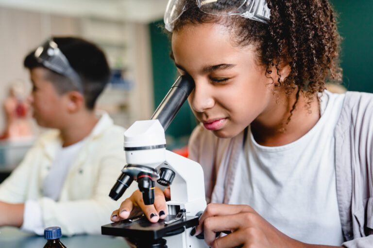 African american Schoolgirl Pupil Student Using Working With Microscope At Biology